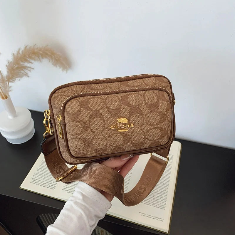 Original Circular-Pattern Logo Crossbody: Retro-luxury, durable fabric, adjustable strap. Ideal for daily/work/social use