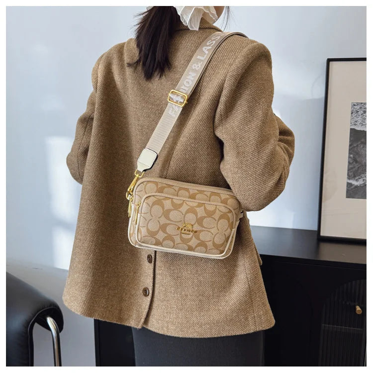 Original Circular-Pattern Logo Crossbody: Retro-luxury, durable fabric, adjustable strap. Ideal for daily/work/social use